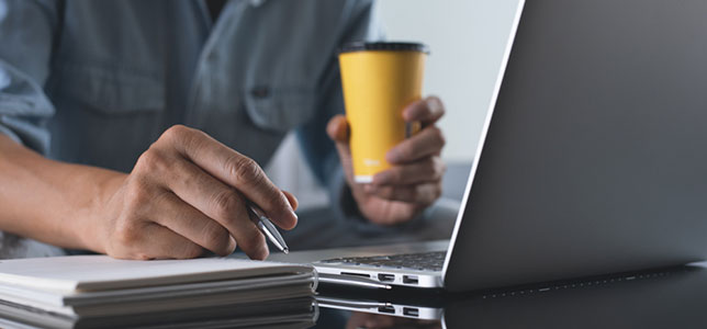 closeup of man working on laptop