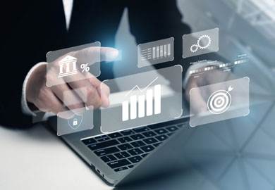 business person with laptop and holographic financial symbols